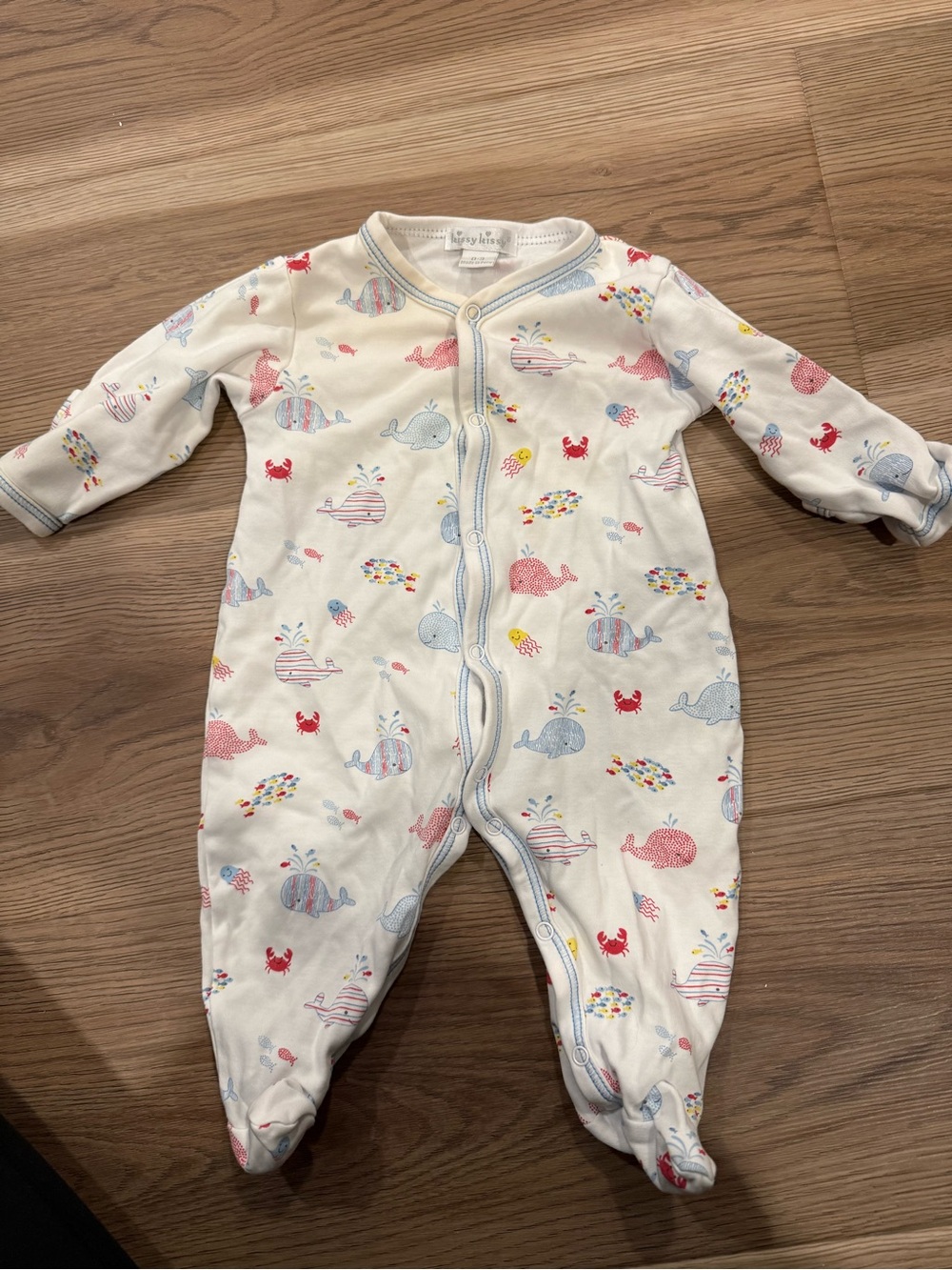 Kissy Kissy Cream Footed One-Piece with Pink, Blue and Yellow Whale Print